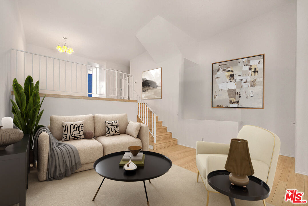 8741 Darby Avenue, Unit 16 Northridge, CA 91325 - Photo 7 of 43 a living room with furniture and a potted plant