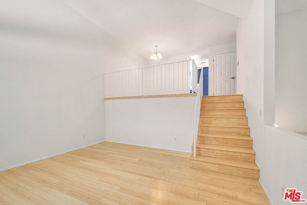 8741 Darby Avenue, Unit 16 Northridge, CA 91325 - Photo 9 of 43 a view of a hallway with stairs