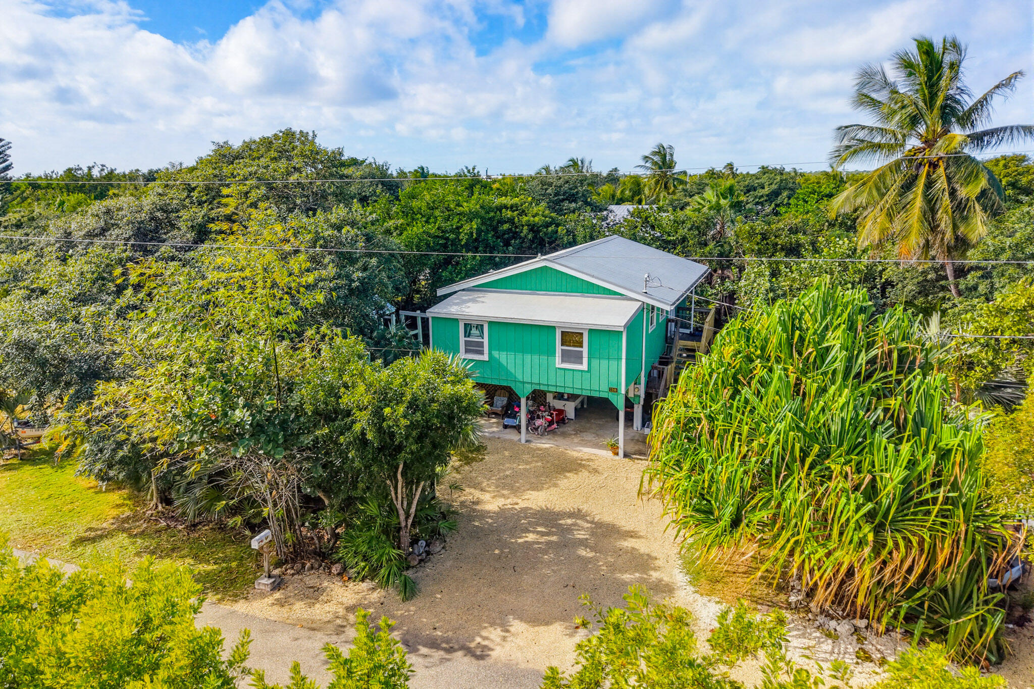 1258 Division Street Big Pine Key, FL 33043 - Photo 18 of 79 a front view of a house with a yard