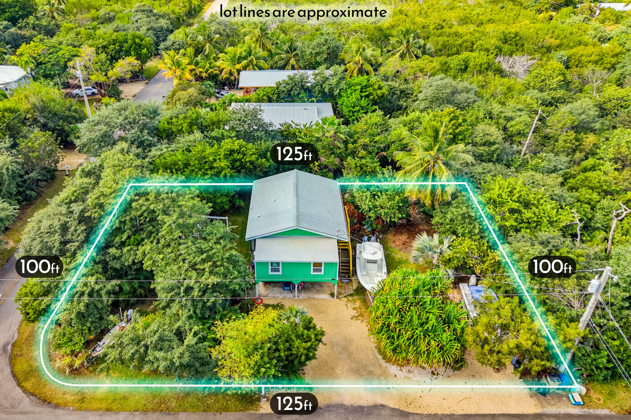 1258 Division Street Big Pine Key, FL 33043 - Photo 2 of 79 an aerial view of residential house with outdoor space and trees all around