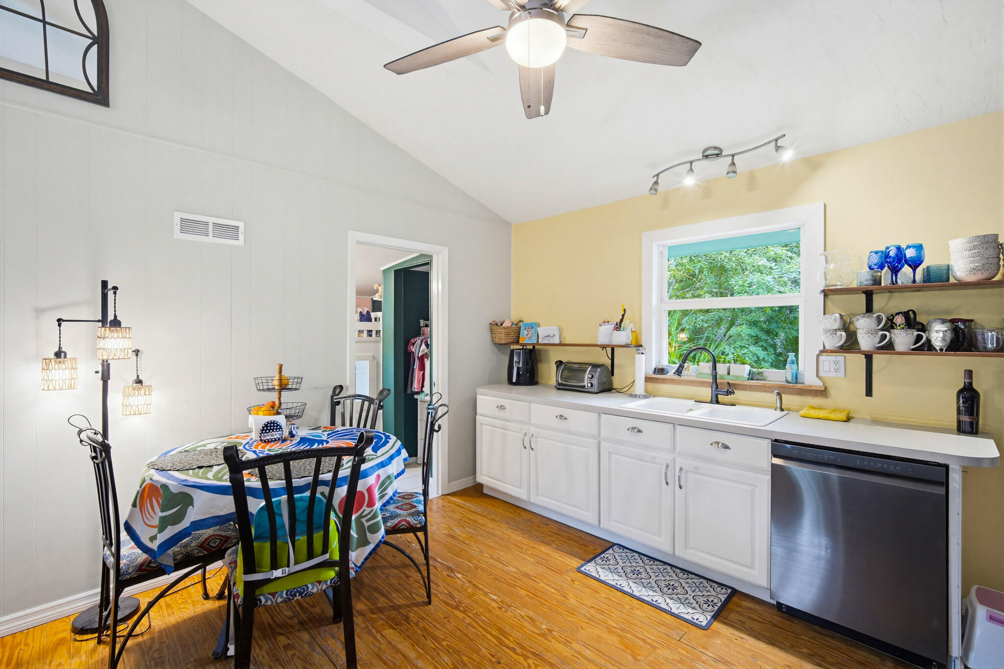 1258 Division Street Big Pine Key, FL 33043 - Photo 44 of 79 a kitchen with a dining table chairs and white appliances