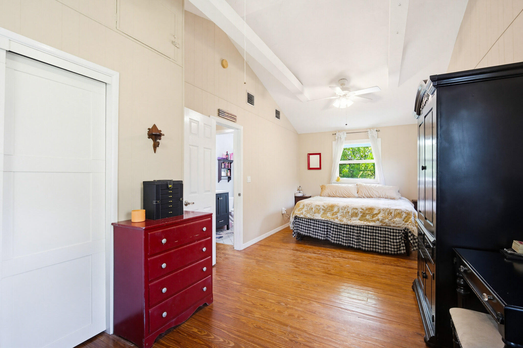 1258 Division Street Big Pine Key, FL 33043 - Photo 50 of 71 a spacious bedroom with a bed and a flat screen tv