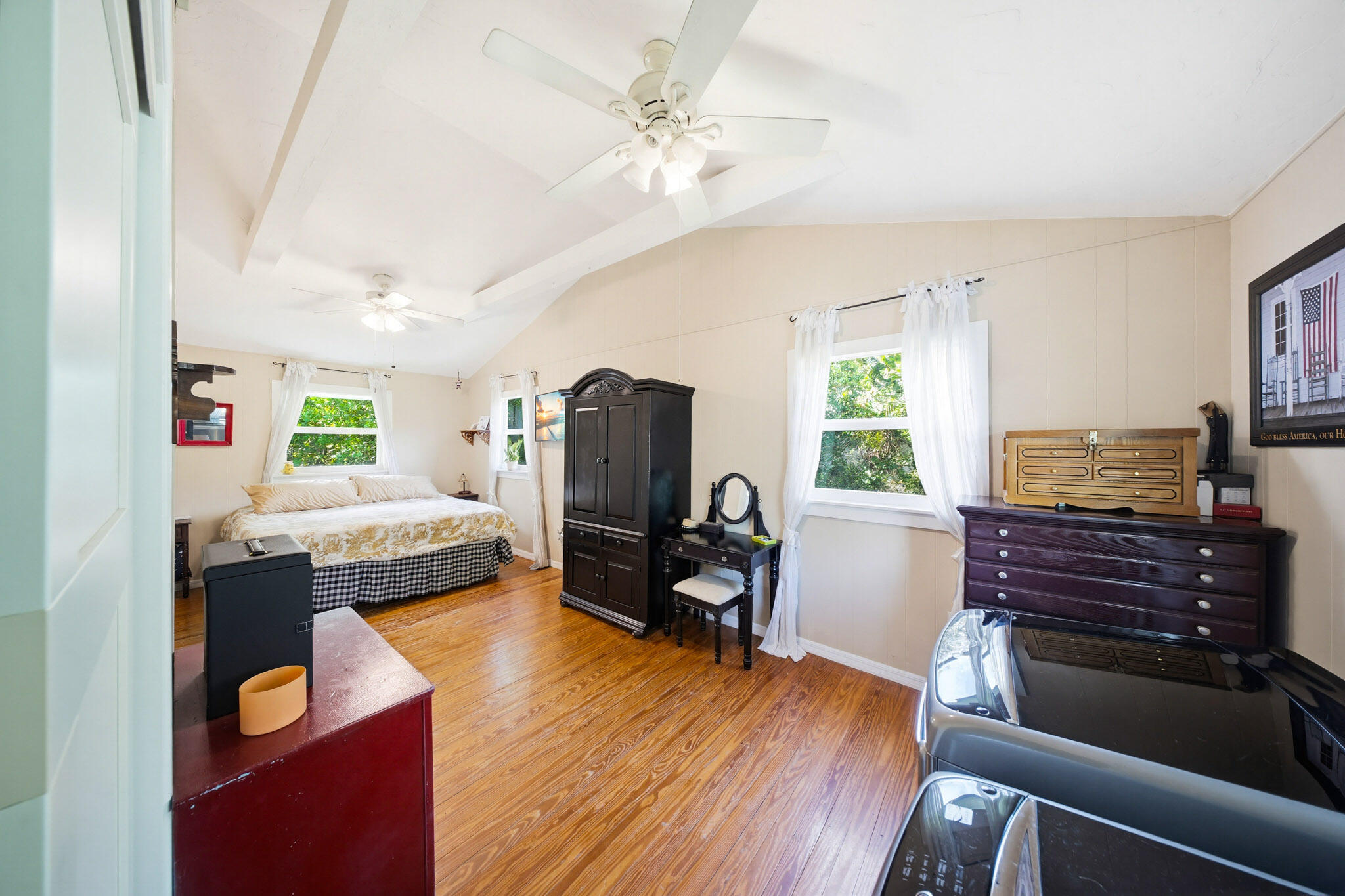 1258 Division Street Big Pine Key, FL 33043 - Photo 51 of 71 a bedroom with furniture and a wooden floor