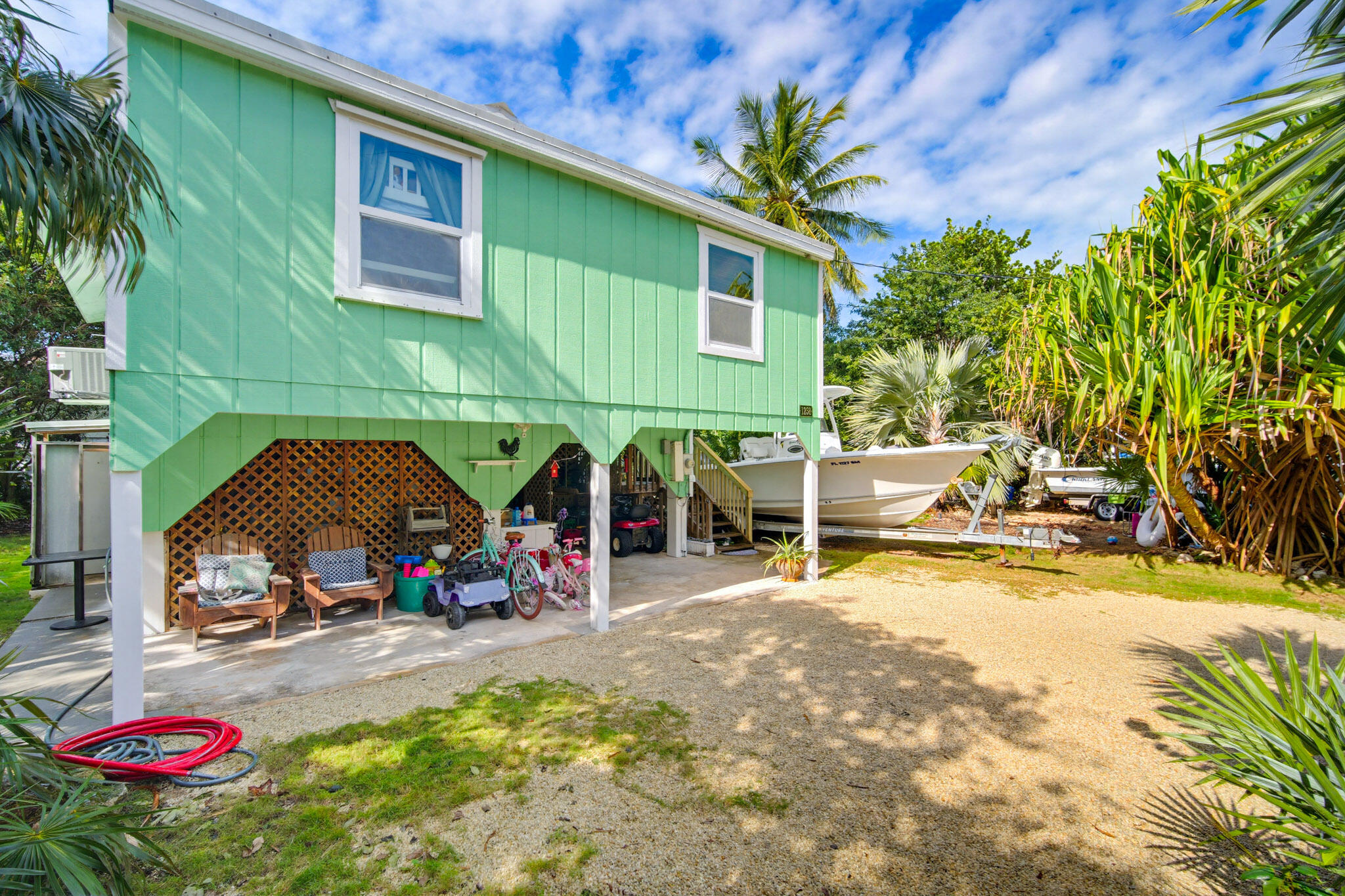 1258 Division Street Big Pine Key, FL 33043 - Photo 61 of 71 a view of a swimming pool with a patio and a garden