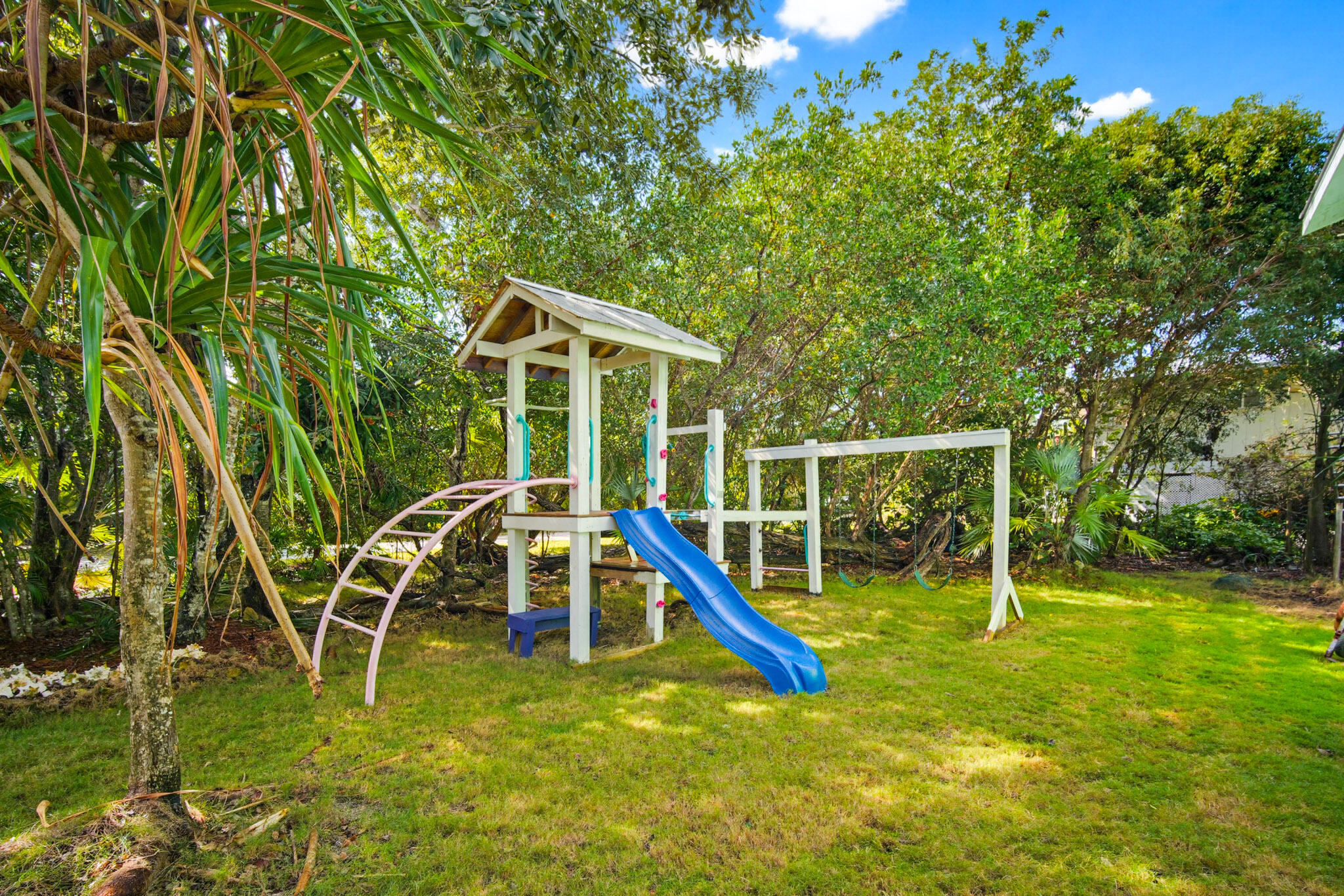 1258 Division Street Big Pine Key, FL 33043 - Photo 70 of 79 a view of a house with a big yard and potted plants