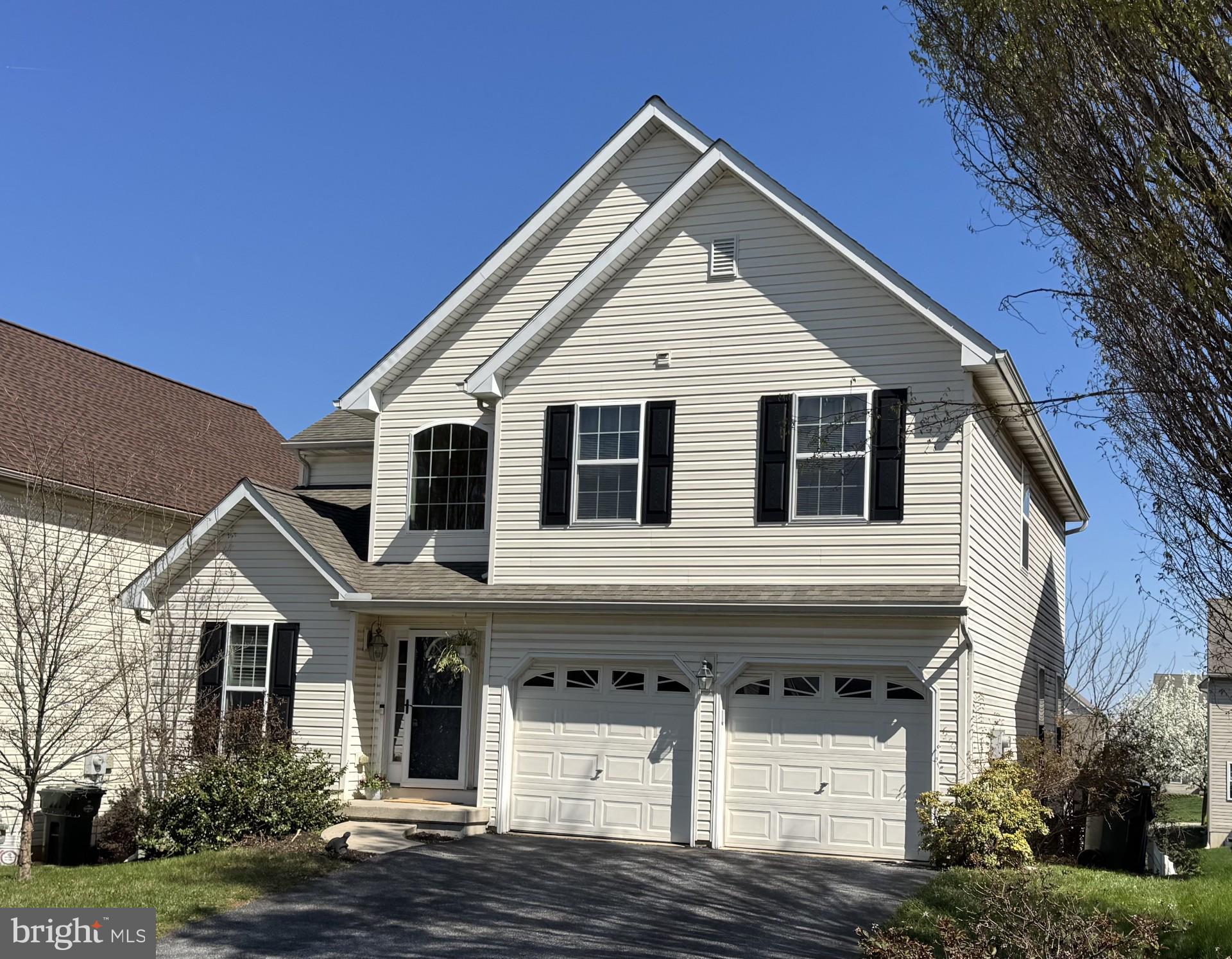 a front view of a house with garage