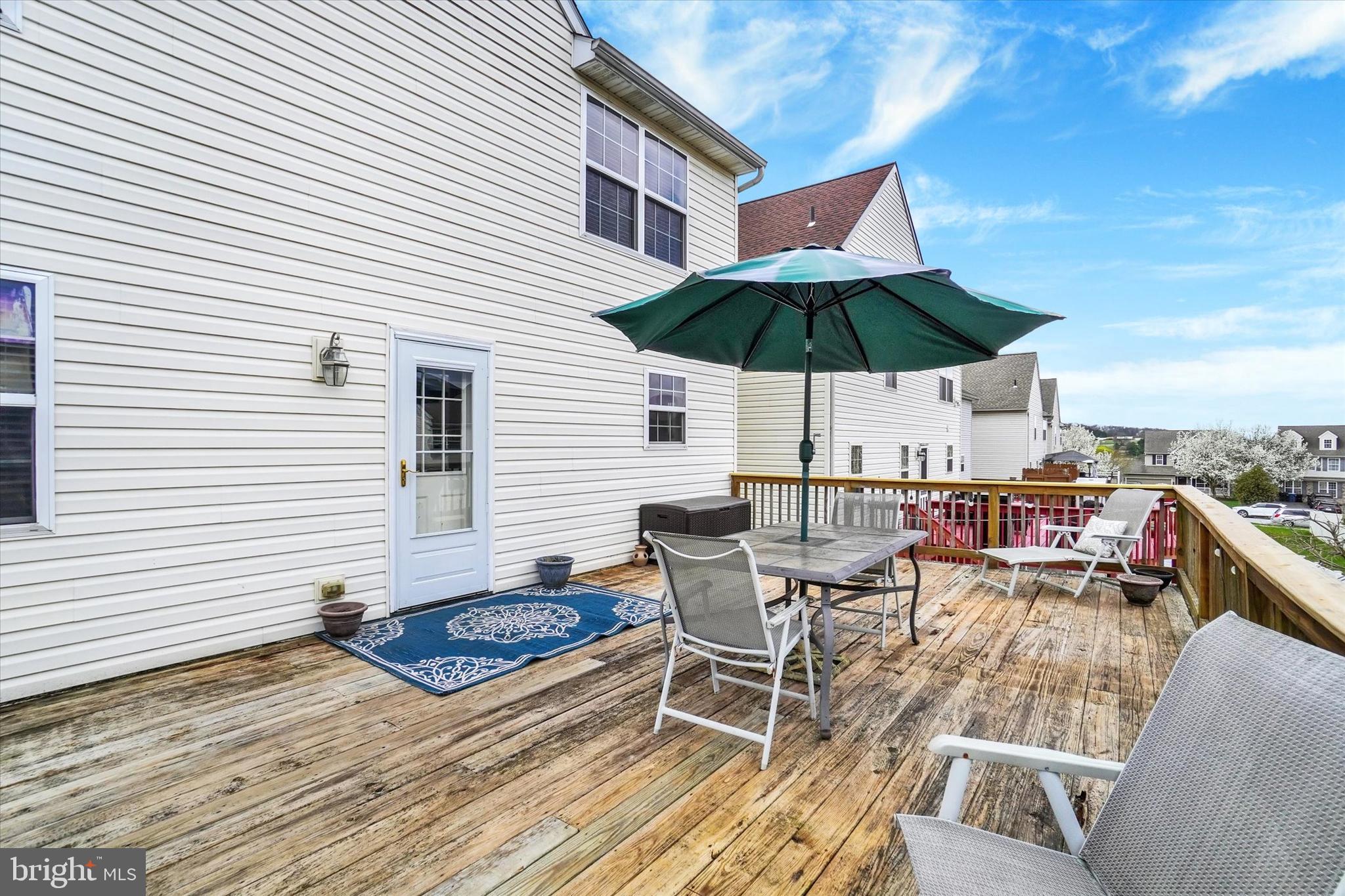 445 Stabley Lane Windsor, PA 17366 - Photo 23 of 26 a view of a roof deck with table and chairs under an umbrella