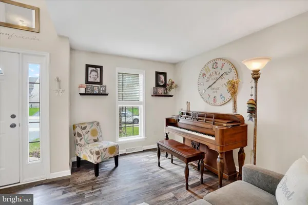 a living room with furniture and a window