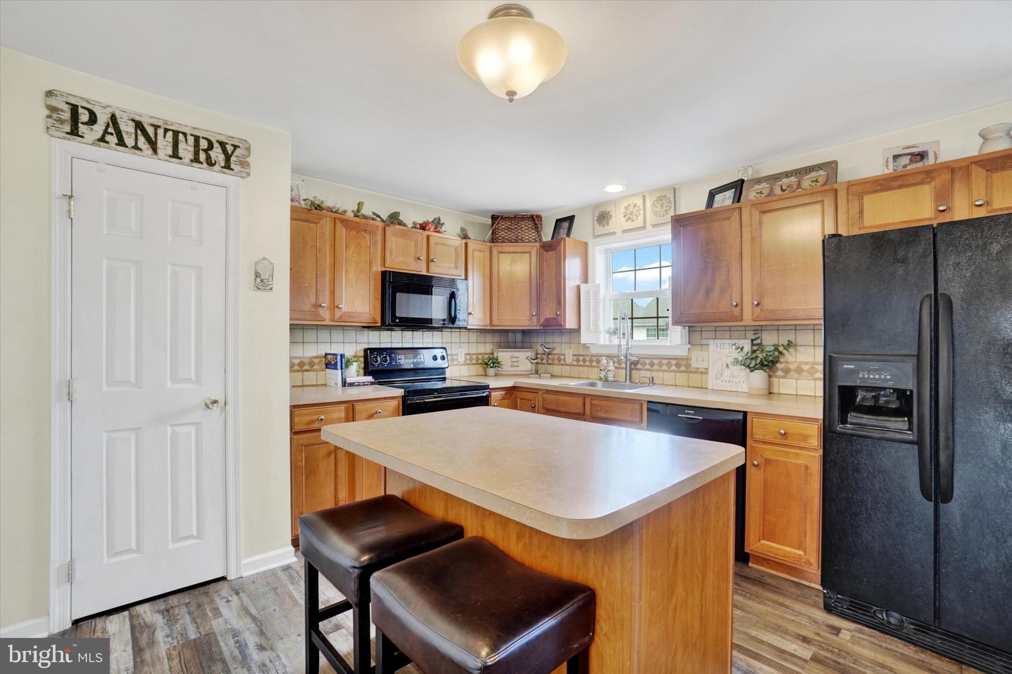 445 Stabley Lane Windsor, PA 17366 - Photo 9 of 26 a kitchen with stainless steel appliances a refrigerator a stove a sink and a refrigerator
