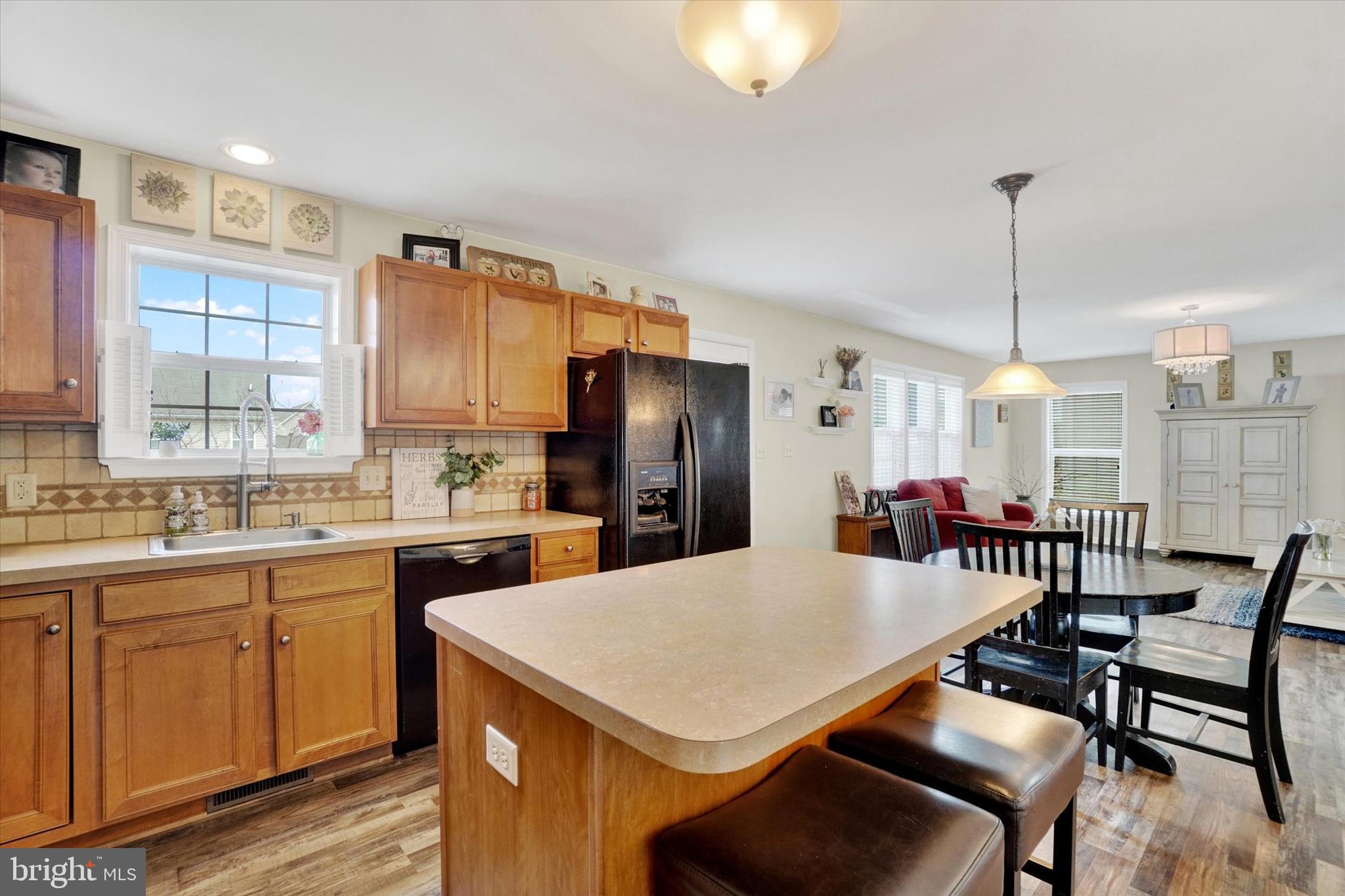 445 Stabley Lane Windsor, PA 17366 - Photo 10 of 26 a kitchen with a dining table chairs and refrigerator