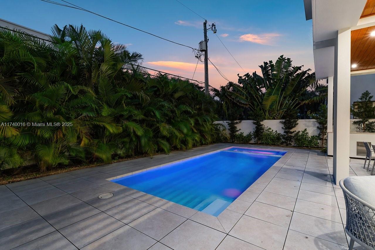 455 Northeast 4th Street Boca Raton, FL 33432 - Photo 54 of 55 a view of swimming pool with a yard and potted plants