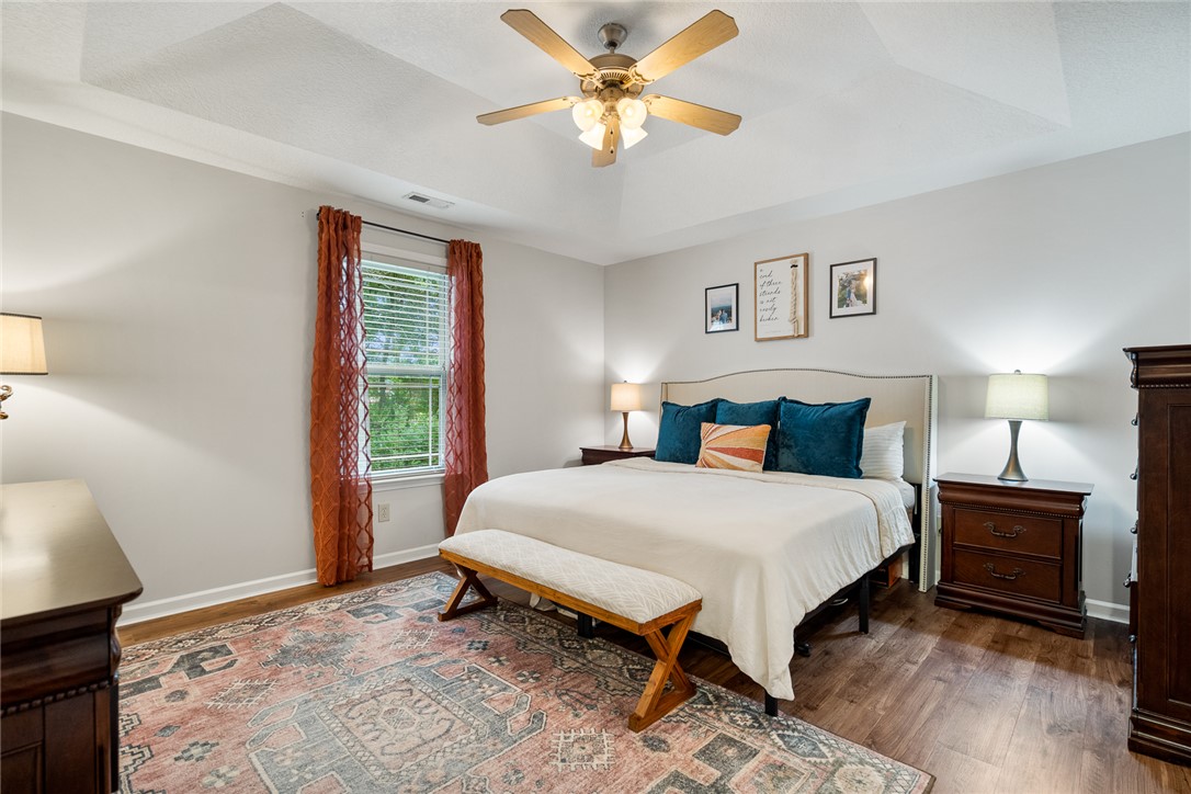 108 Belspring Lane Anderson, SC 29621 - Photo 11 of 19 This spacious bedroom features elegant flooring and a window offering abundant natural light.