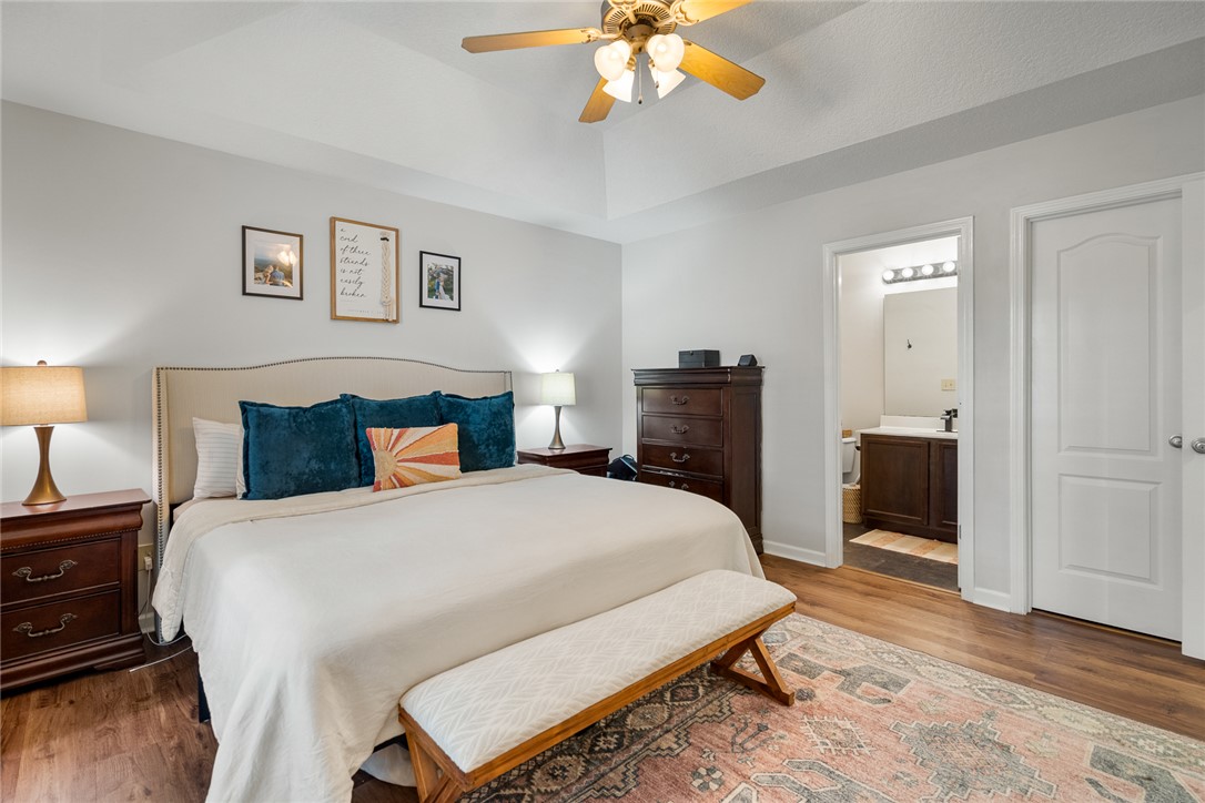 108 Belspring Lane Anderson, SC 29621 - Photo 13 of 19 This inviting bedroom features rich hardwood flooring and a functional tray ceiling.