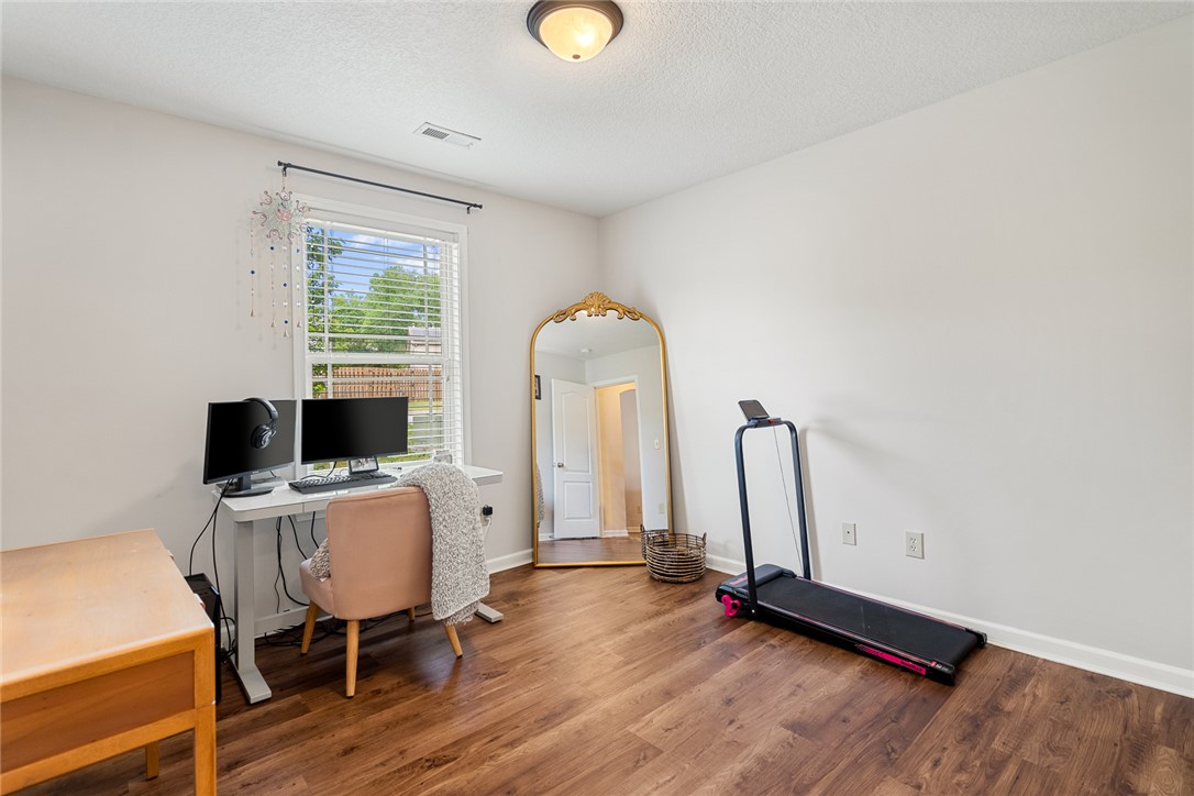 108 Belspring Lane Anderson, SC 29621 - Photo 15 of 19 This bedroom features hardwood floors, a large window, and ample space