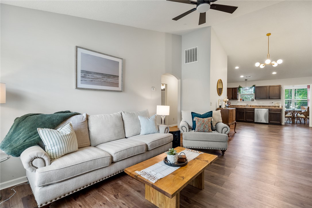 108 Belspring Lane Anderson, SC 29621 - Photo 4 of 19 This bright living area features vaulted ceilings and rich wood flooring, flowing into a modern kitchen.