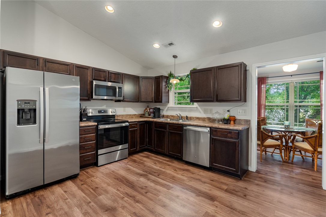 108 Belspring Lane Anderson, SC 29621 - Photo 5 of 19 This inviting kitchen boasts modern appliances and warm cabinetry, ideal for everyday living and entertaining.