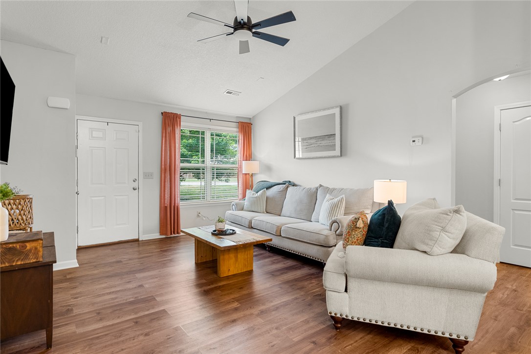 108 Belspring Lane Anderson, SC 29621 - Photo 7 of 19 This inviting living area features warm wood flooring and a refreshing ceiling fan.