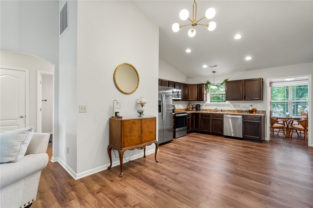 108 Belspring Lane Anderson, SC 29621 - Photo 8 of 19 This open concept kitchen features warm wood cabinetry and a spacious layout with abundant natural light.