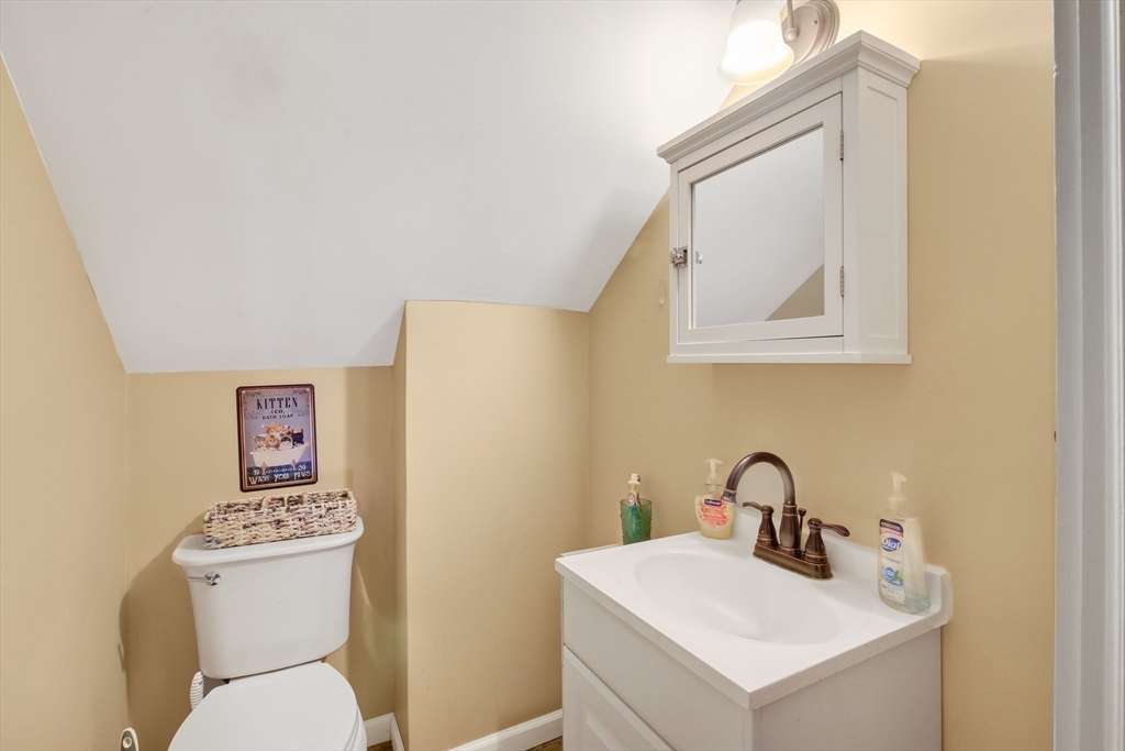 1038 Morgan Road West Springfield, MA 01089 - Photo 23 of 31 a bathroom with a toilet sink and mirror