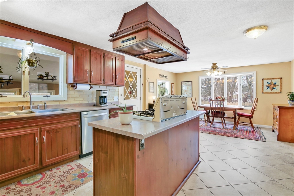 1038 Morgan Road West Springfield, MA 01089 - Photo 8 of 31 a kitchen with stainless steel appliances granite countertop a sink and cabinets