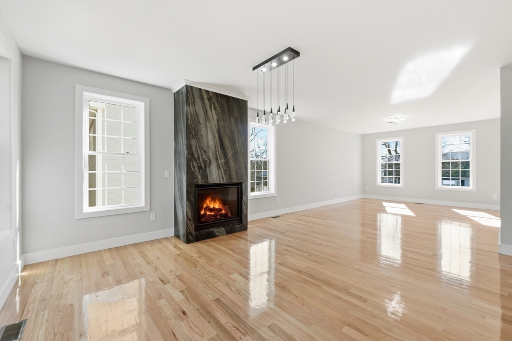 6 Barrows Road Worcester, MA 01609 - Photo 11 of 41 a view of empty room with fireplace and wooden floor