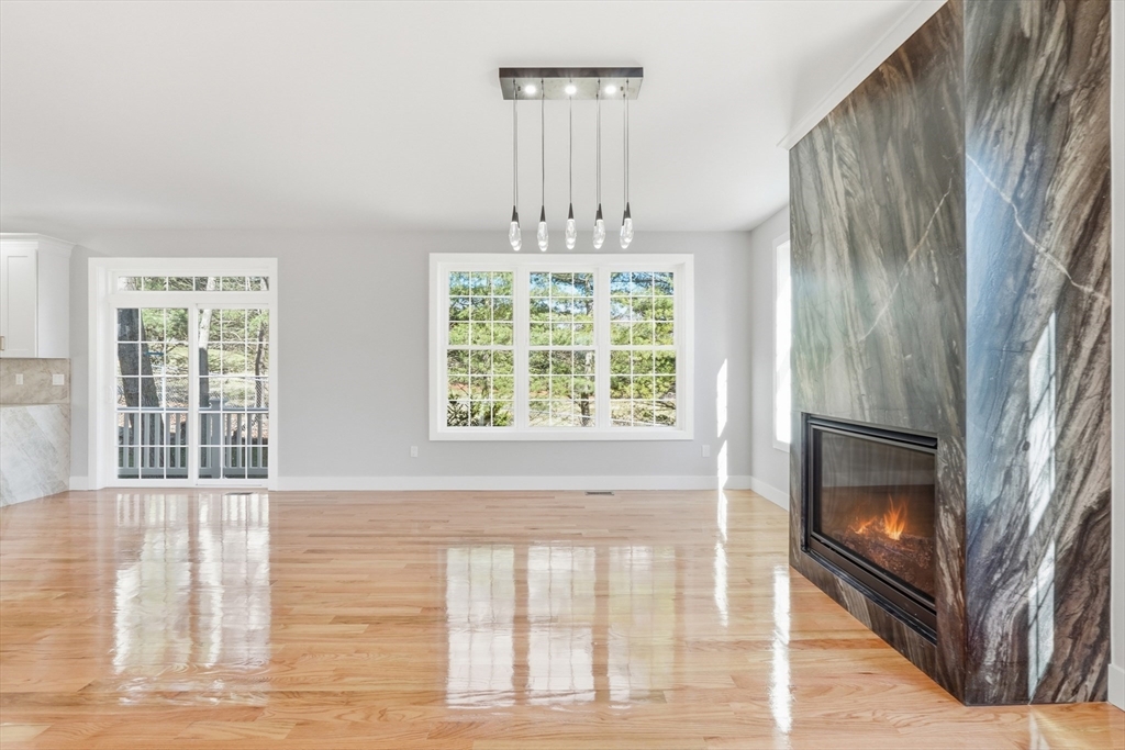 6 Barrows Road Worcester, MA 01609 - Photo 13 of 41 a view of an empty room with wooden floor and a window