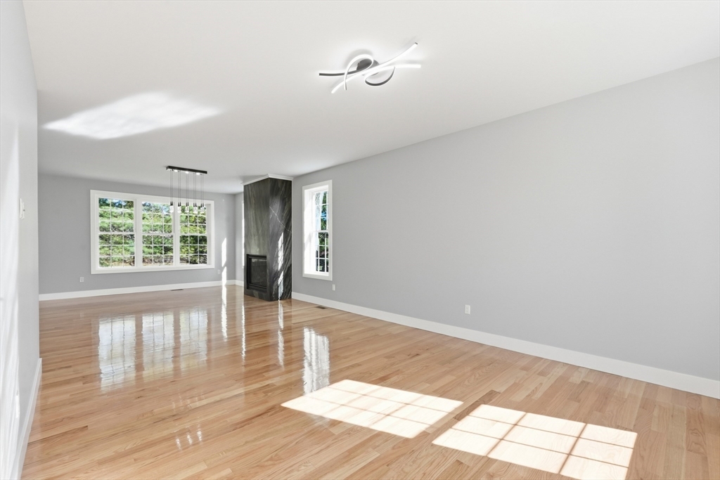 6 Barrows Road Worcester, MA 01609 - Photo 15 of 41 a view of an empty room with wooden floor and a window