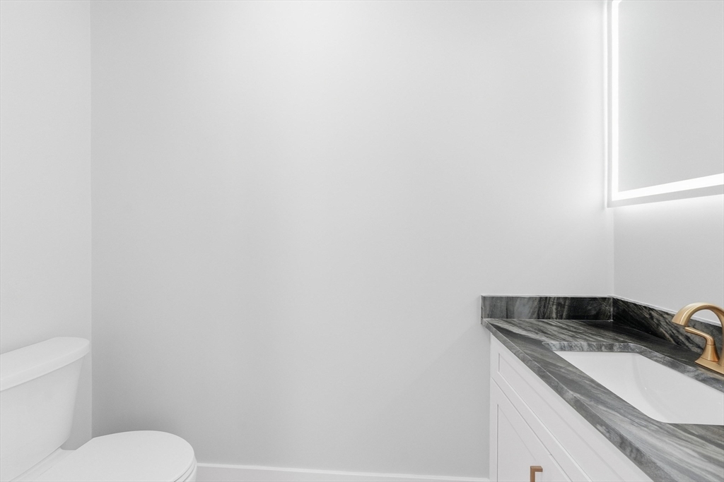 6 Barrows Road Worcester, MA 01609 - Photo 21 of 41 a bathroom with a granite countertop toilet and sink