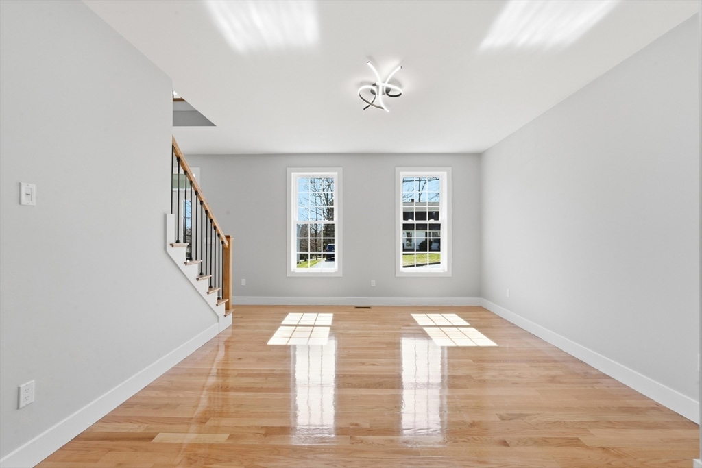 6 Barrows Road Worcester, MA 01609 - Photo 22 of 41 a view of an empty room with wooden floor and a window