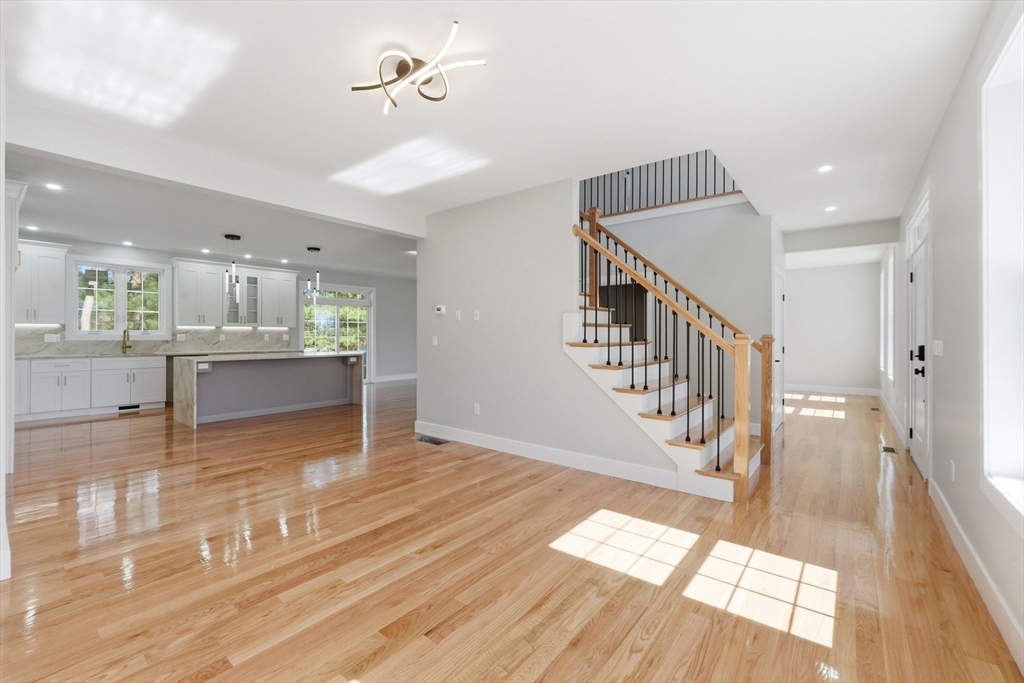 6 Barrows Road Worcester, MA 01609 - Photo 24 of 41 a view of a living room with wooden floor and a kitchen