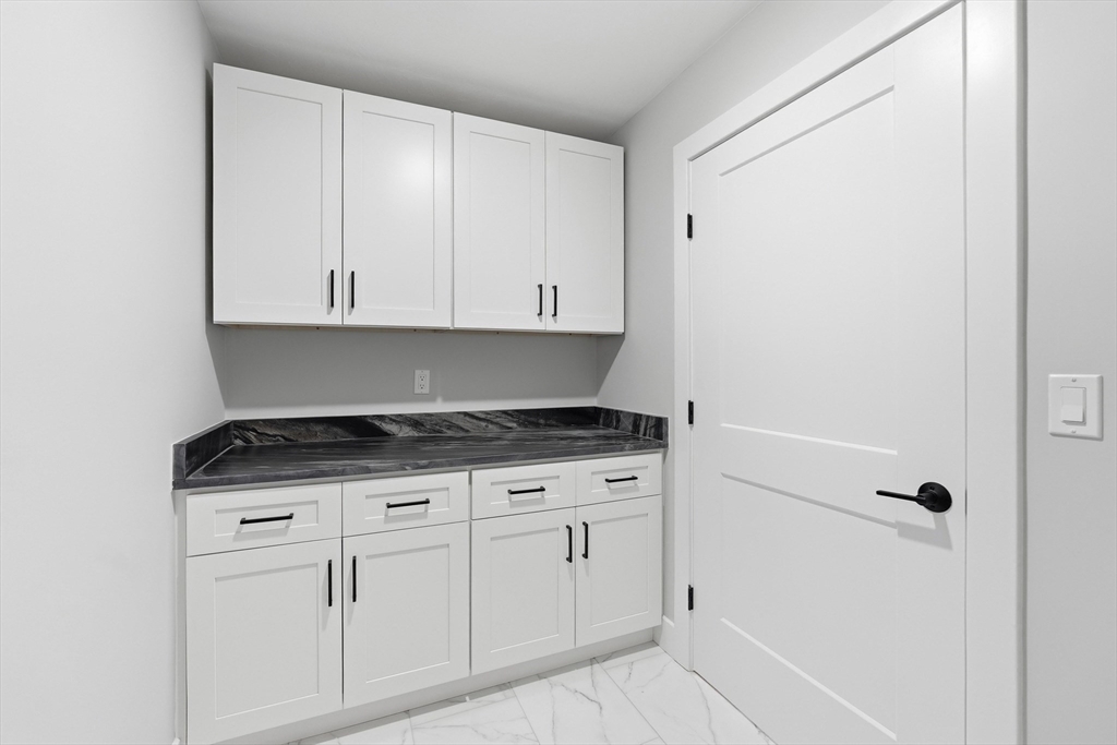 6 Barrows Road Worcester, MA 01609 - Photo 30 of 41 a kitchen with granite countertop white cabinets and white appliances