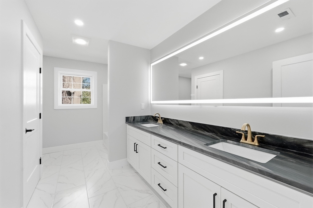 6 Barrows Road Worcester, MA 01609 - Photo 33 of 41 a kitchen with granite countertop white cabinets and sink