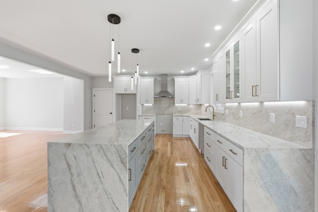 6 Barrows Road Worcester, MA 01609 - Photo 5 of 41 a large kitchen with stainless steel appliances kitchen island granite countertop a sink and cabinets