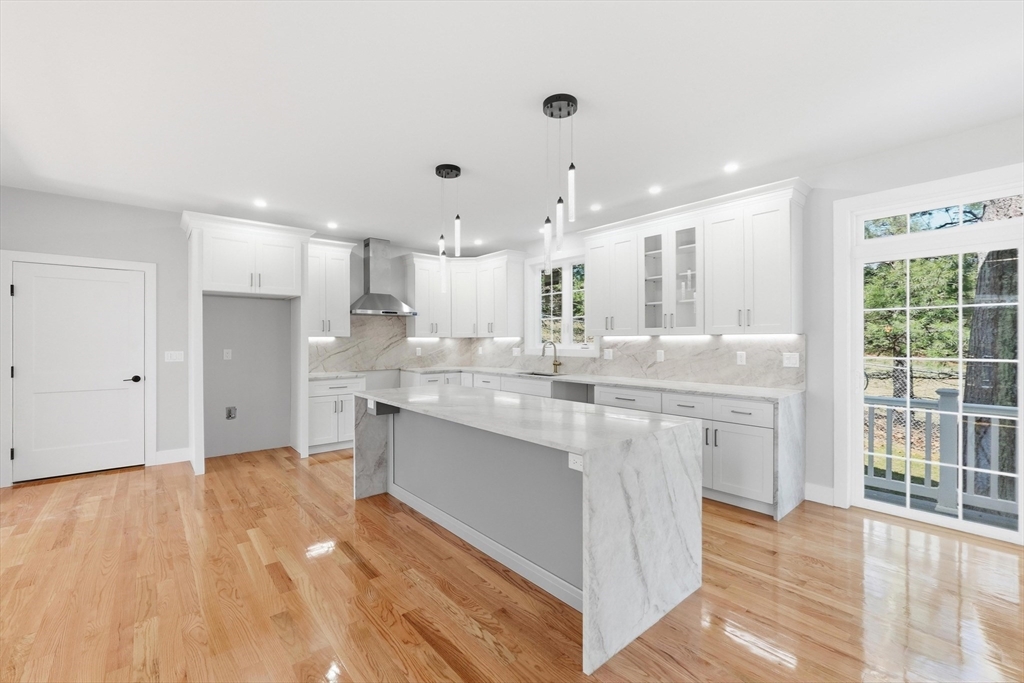 6 Barrows Road Worcester, MA 01609 - Photo 6 of 41 a large kitchen with kitchen island a sink stainless steel appliances and cabinets
