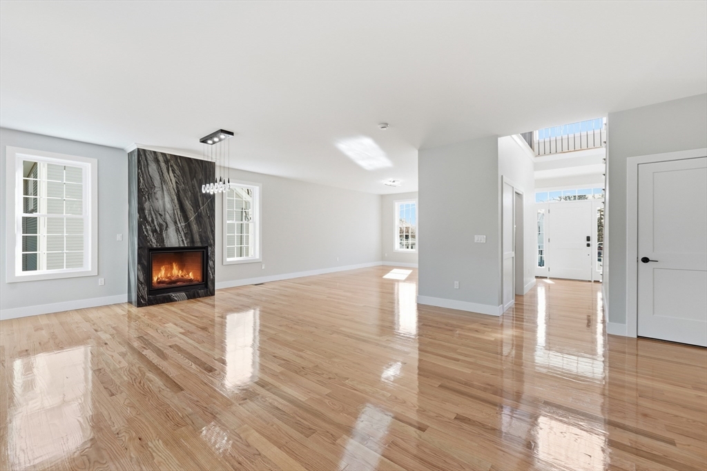 6 Barrows Road Worcester, MA 01609 - Photo 9 of 41 a view of an empty room with wooden floor and a window