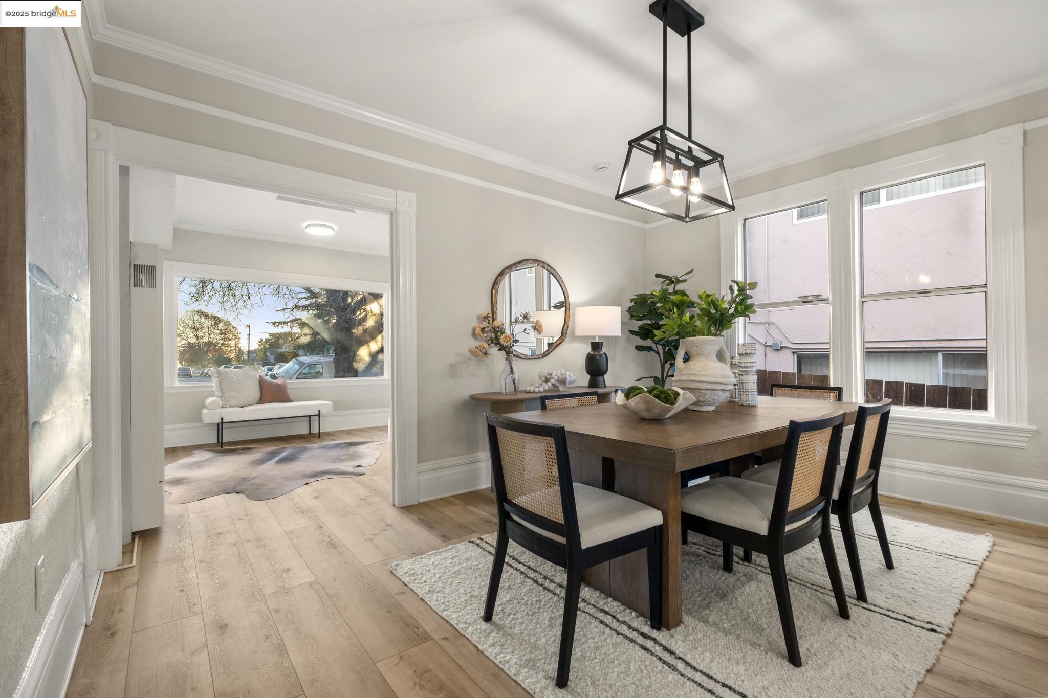 2050 East 30th Street Oakland, CA 94606 - Photo 11 of 48 Dining area with light wood-type flooring and ornamental molding