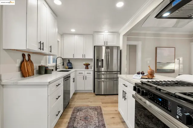 a kitchen with a stove and a refrigerator