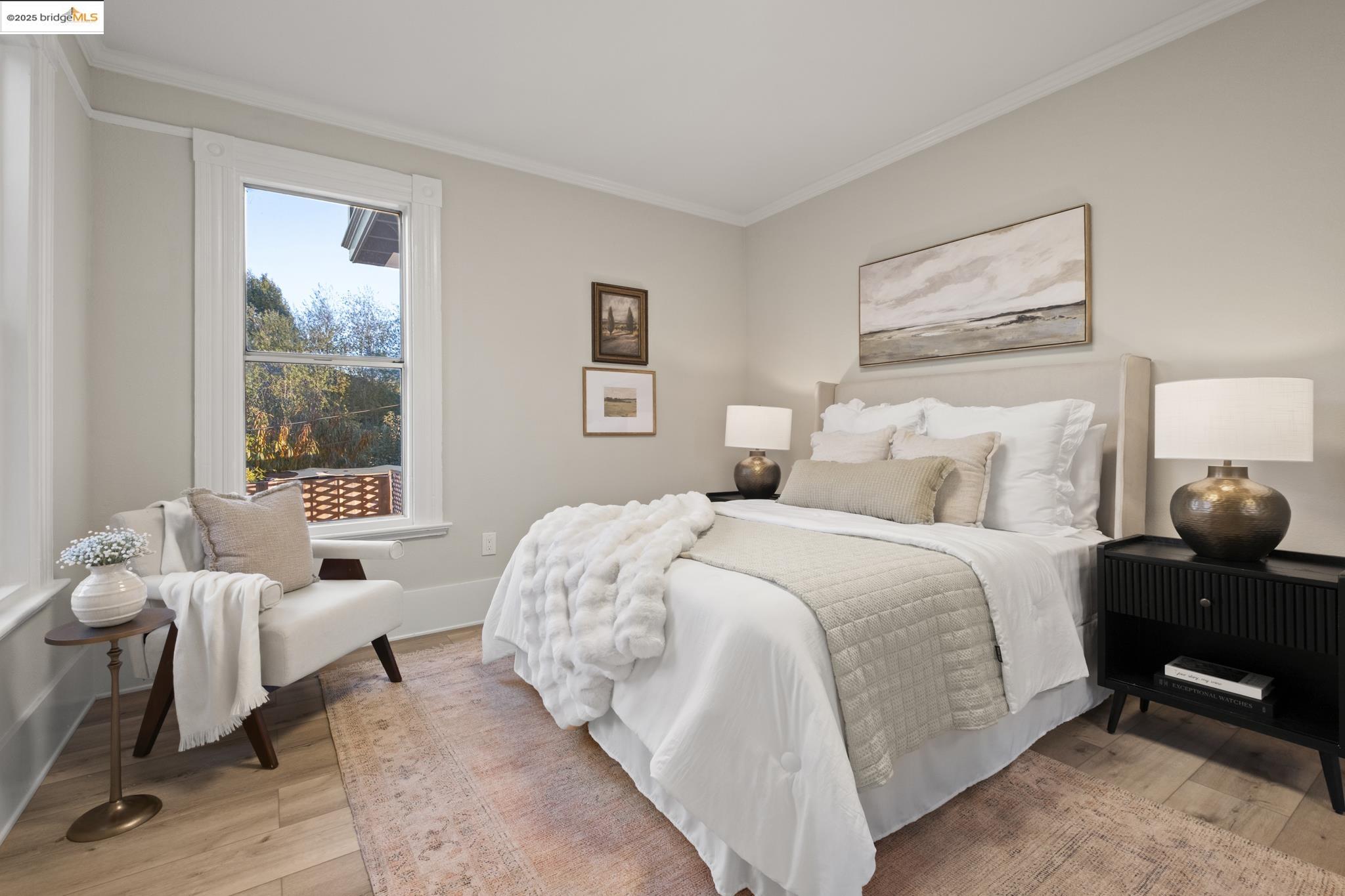 2050 East 30th Street Oakland, CA 94606 - Photo 18 of 48 Bedroom featuring light wood finished floors and ornamental molding
