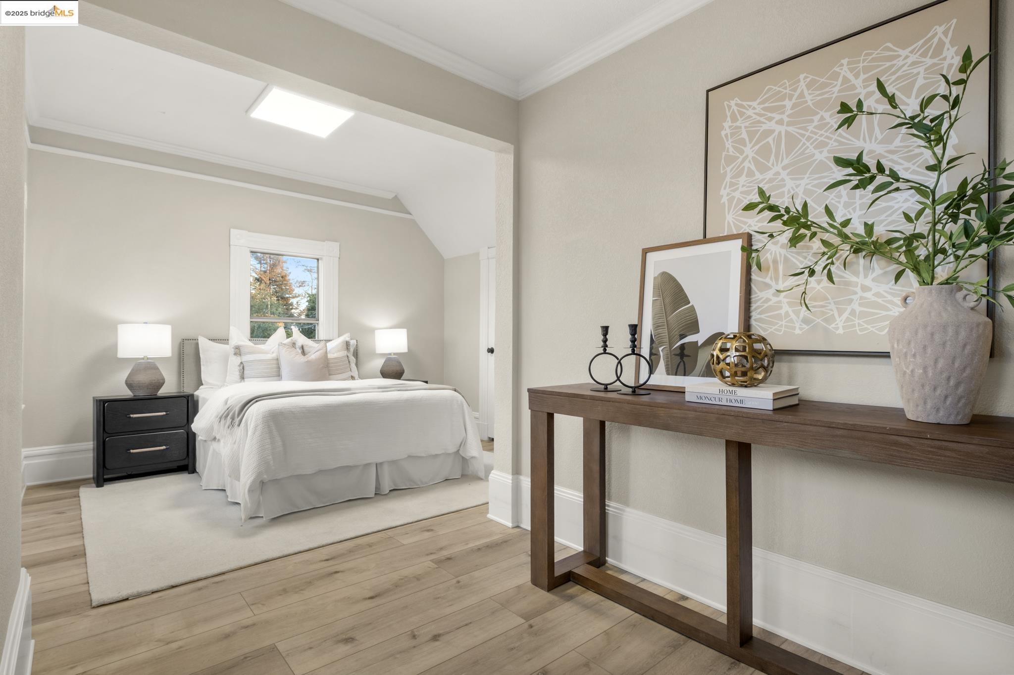 2050 East 30th Street Oakland, CA 94606 - Photo 24 of 48 Bedroom featuring light wood-type flooring and ornamental molding