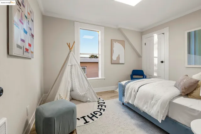 a bedroom with a bed and a couch