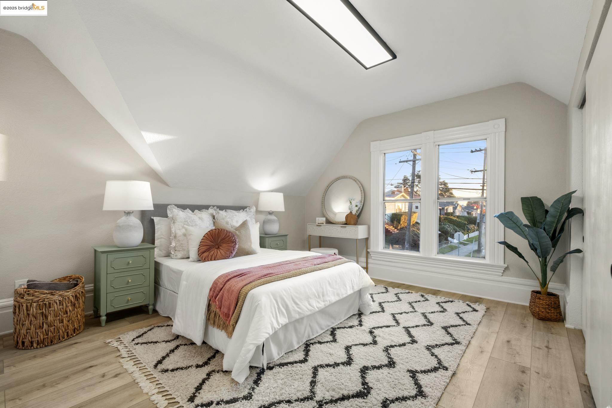 2050 East 30th Street Oakland, CA 94606 - Photo 28 of 48 Bedroom with lofted ceiling and light wood-type flooring