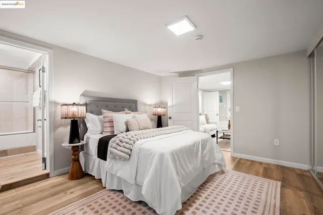 a bedroom with double bed and a window