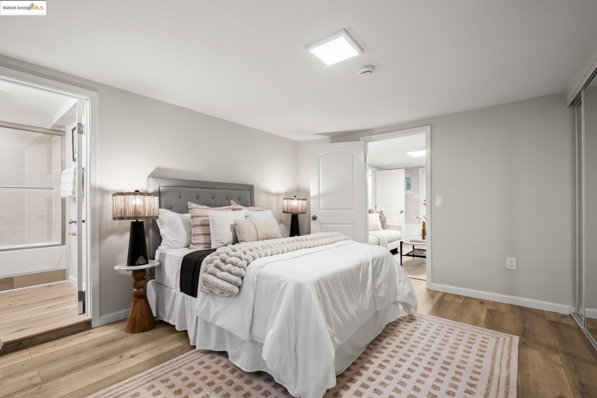 2050 East 30th Street Oakland, CA 94606 - Photo 36 of 48 Bedroom with light wood-style floors and baseboards