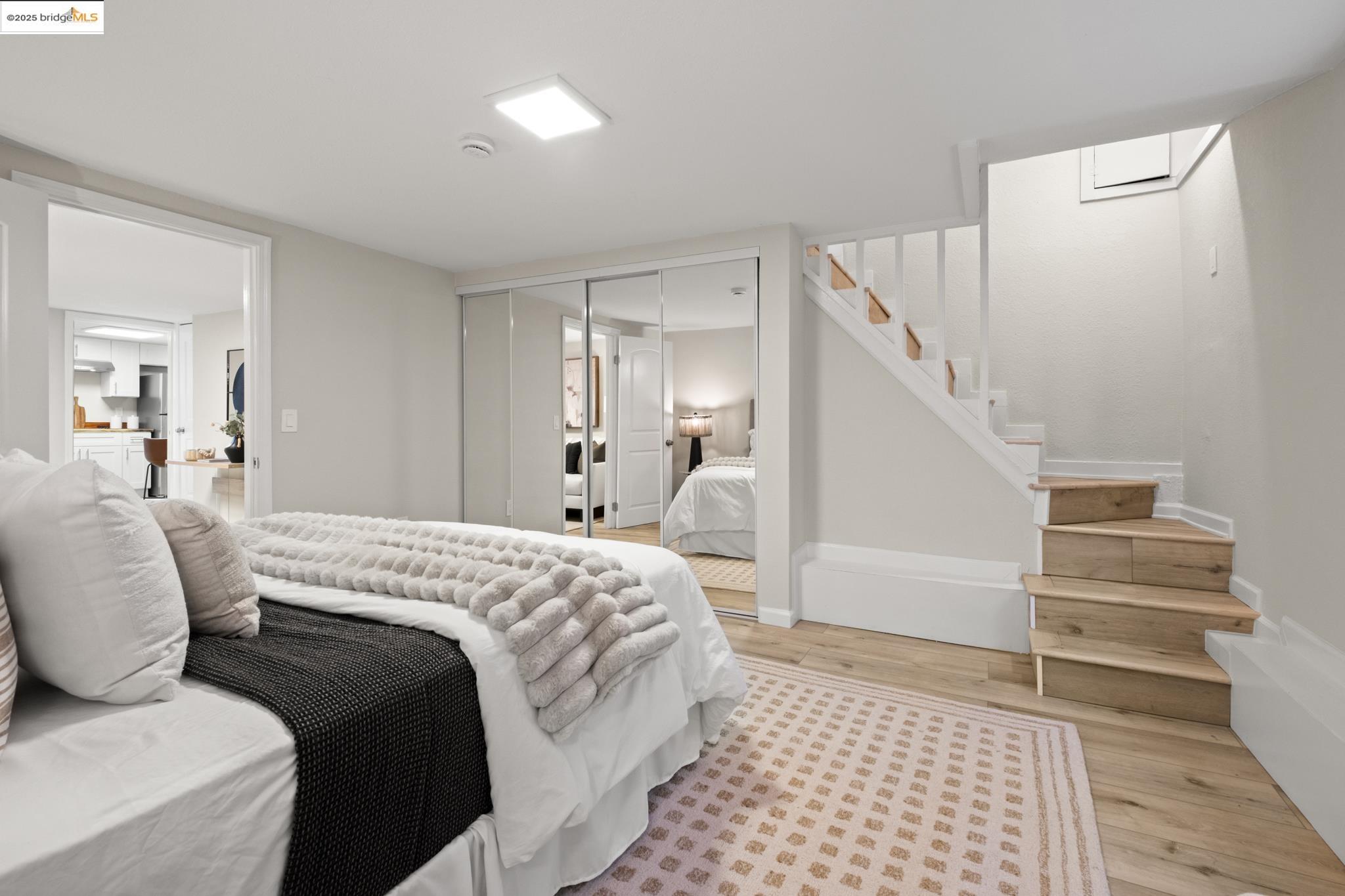 2050 East 30th Street Oakland, CA 94606 - Photo 37 of 48 Bedroom with wood finished floors and a closet