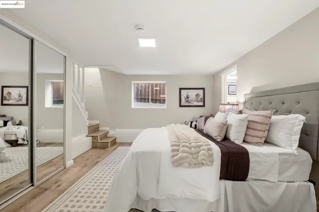 a bedroom with a large bed and a view of bedroom