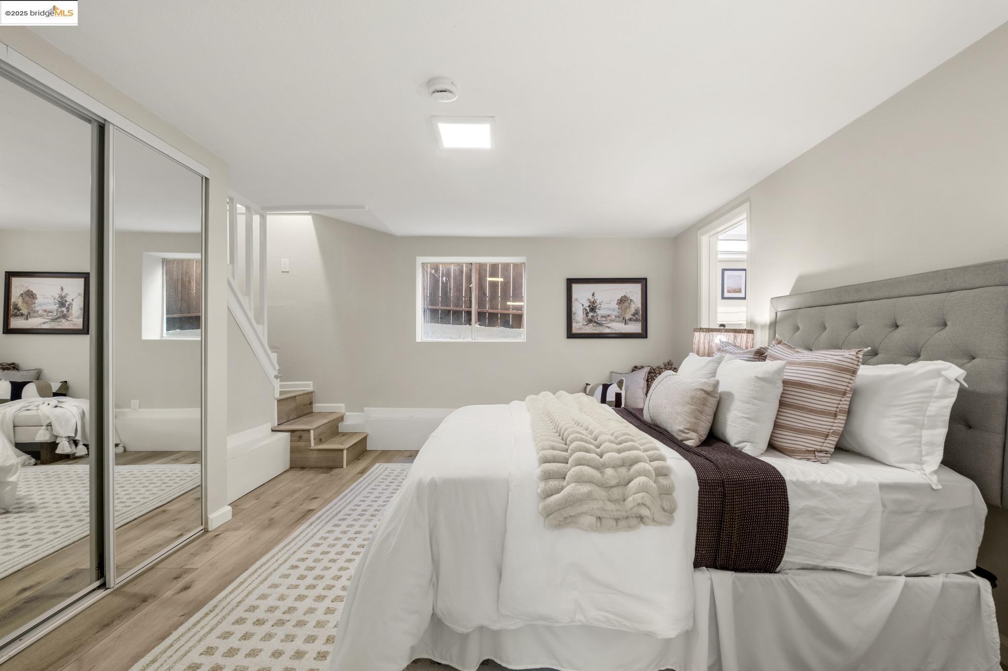 2050 East 30th Street Oakland, CA 94606 - Photo 38 of 48 Bedroom featuring wood finished floors and a closet