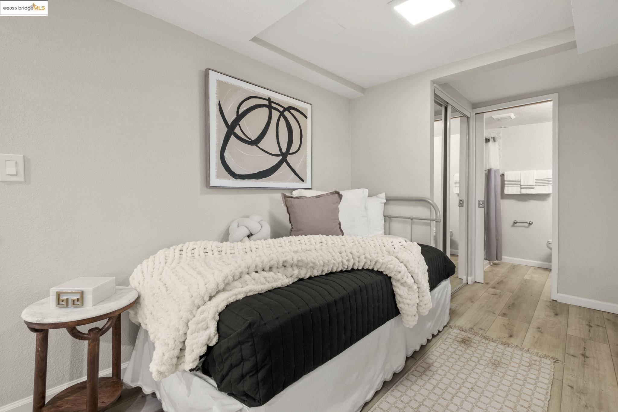 2050 East 30th Street Oakland, CA 94606 - Photo 40 of 48 Bedroom with wood-type flooring and ensuite bathroom