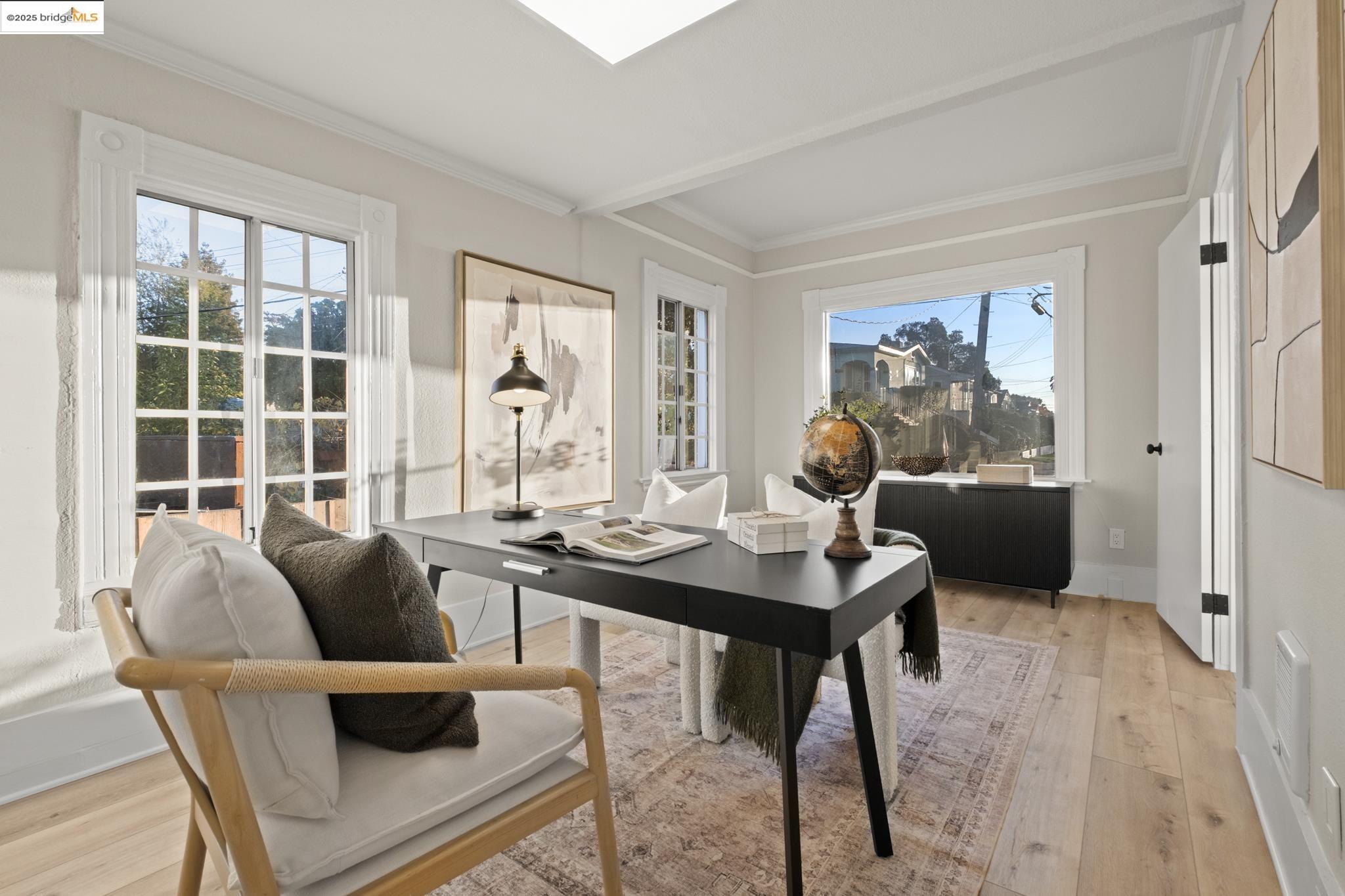 2050 East 30th Street Oakland, CA 94606 - Photo 7 of 48 Office space with light wood-style flooring, crown molding, and healthy amount of natural light