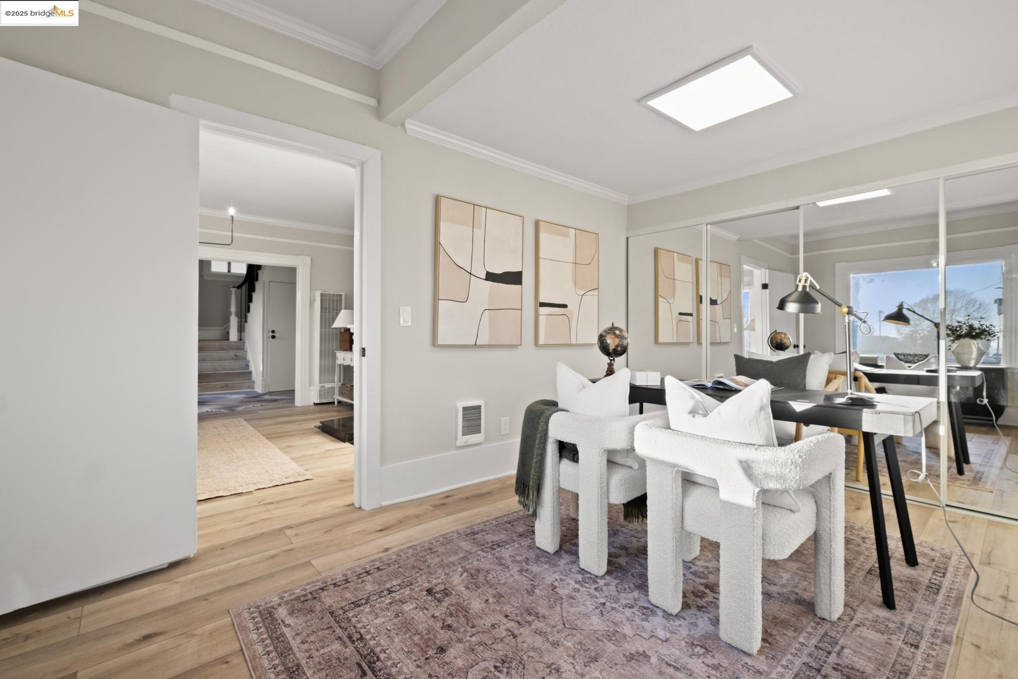 2050 East 30th Street Oakland, CA 94606 - Photo 8 of 48 Dining space with stairway, light wood-style floors, and crown molding