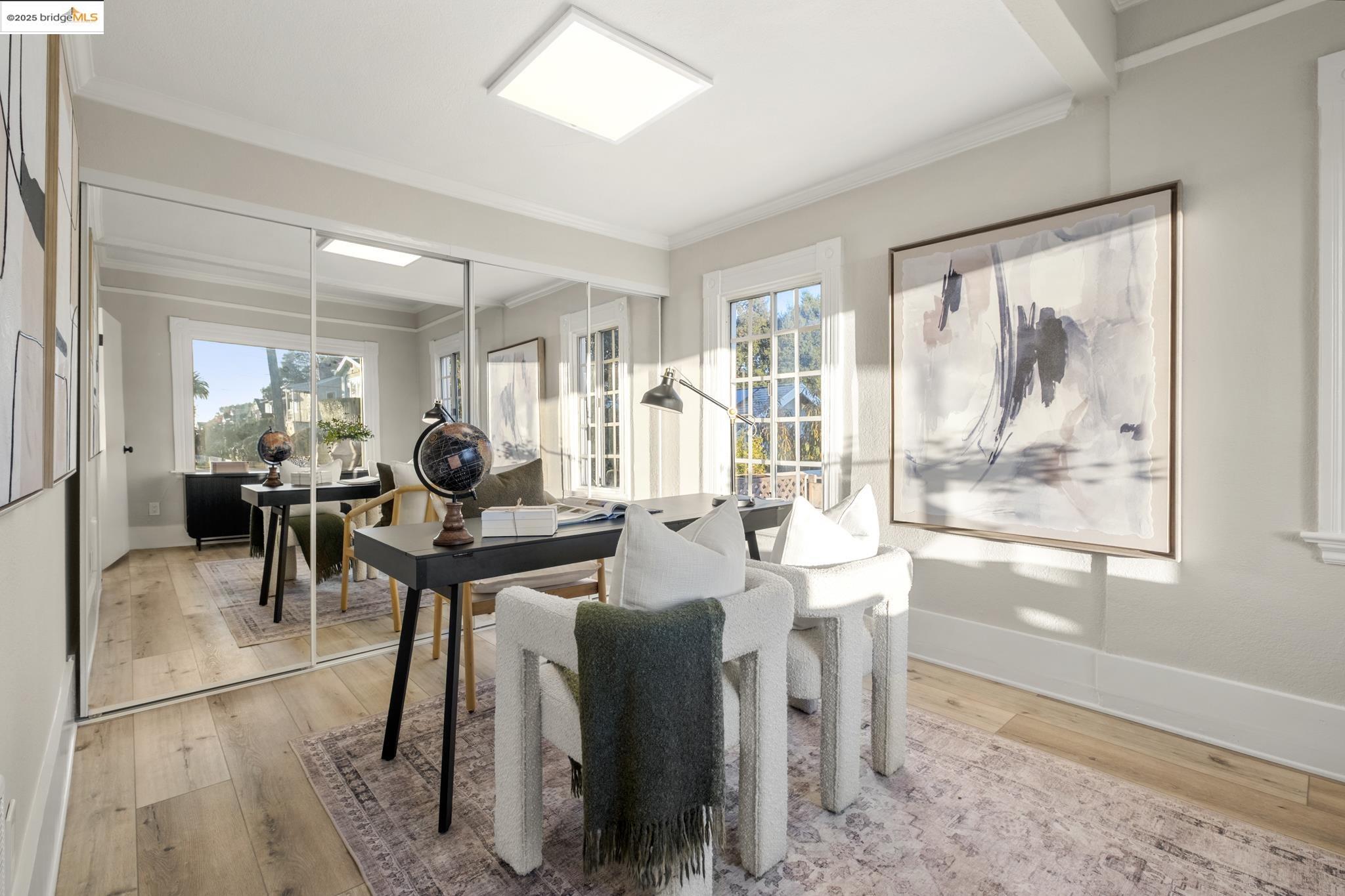 2050 East 30th Street Oakland, CA 94606 - Photo 9 of 48 Dining room featuring light wood-style floors, plenty of natural light, and ornamental molding